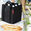 bottlebag met 9 flessen erin kleur black op eettafel