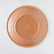 Achterkant van een plat bord in kunststof Rio Medallion met terracotta look.